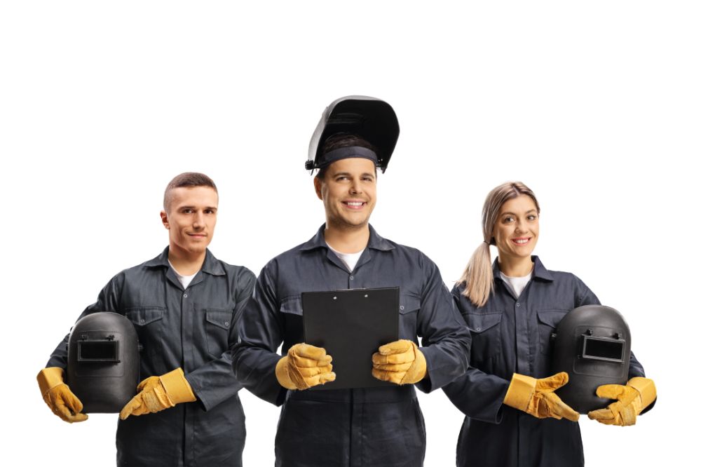 Team of a welders in uniforms