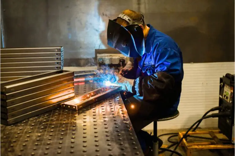 Working welder welds parts factory
